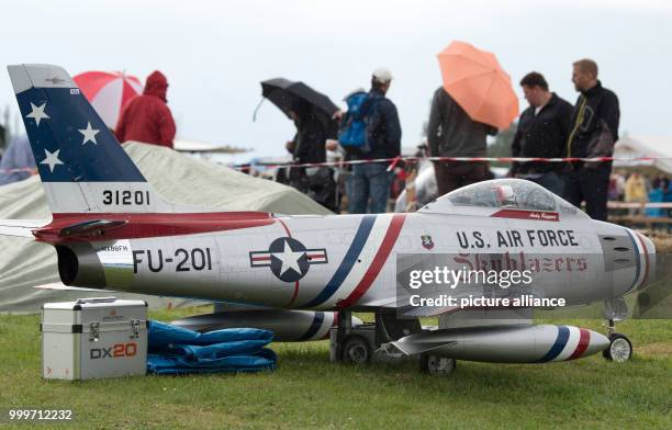 Visitors at the "Mega Flugshow" air show standing behind a model "U.S. Air Force FU-201" plane in Goettingen, Germany, 2 September 2017. Around 90...