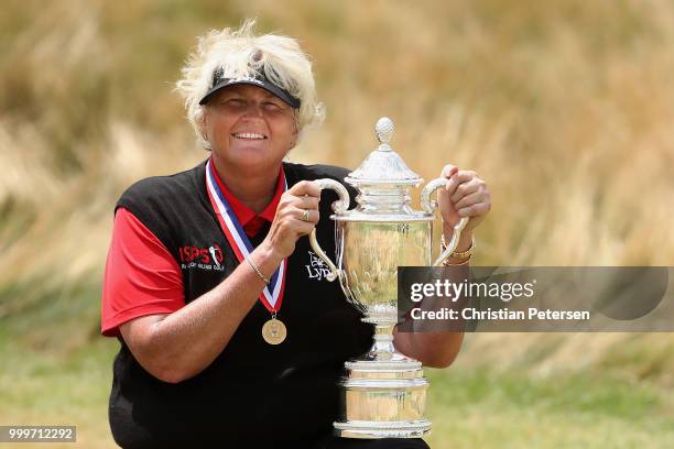 Laura Davies of England poses with the U.S. Senior Women's Open trophy after winning in the final round at Chicago Golf Club on July 15, 2018 in...
