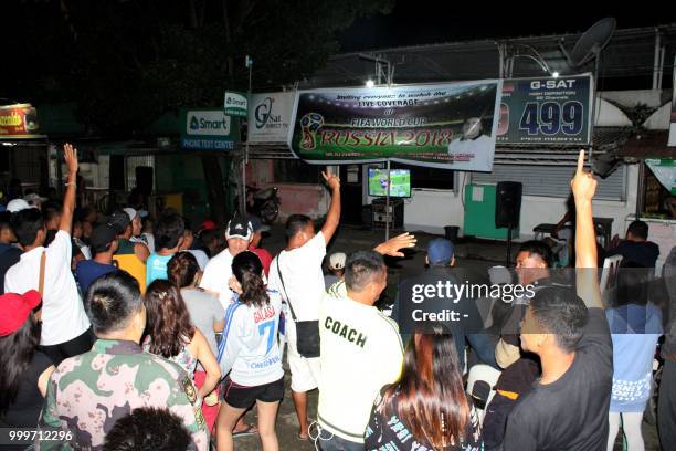 Residents react after France won against Croatia during a live telecast from Russia of the final between Croatia and France of World Cup football...