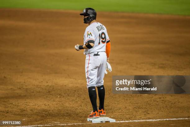 Miami Marlins third baseman Miguel Rojas reaches first base after a two-run single in the fifth inning to give the Marlins a 6-5 lead over the...