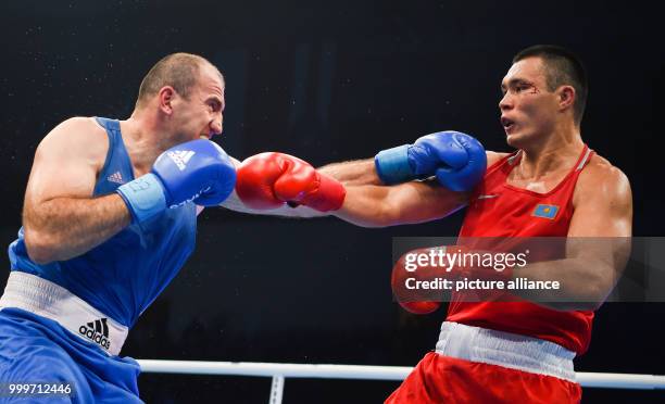 Kamshybek Kunkabayev of Kazakhstan fighting Mahammadrasul Majidov of Azerbaijan in the super heavyweight final bout of the AIBA World Boxing...