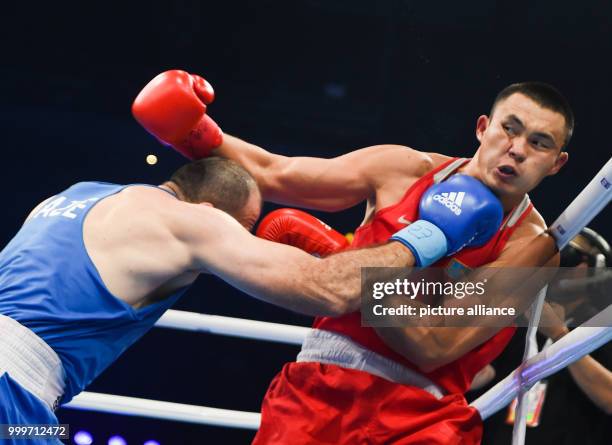 Kamshybek Kunkabayev of Kazakhstan fighting Mahammadrasul Majidov of Azerbaijan in the super heavyweight final bout of the AIBA World Boxing...