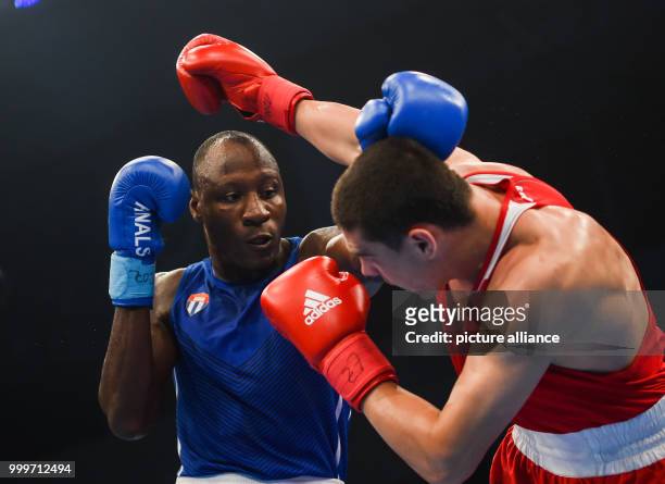 Erislandy Savon of Cuba fighting Evgeny Tishchenko of Russia in the heavyweight final bout of the AIBA World Boxing Championships in Hamburg,...