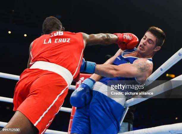 Julio La Cruz of Cuba fighting Joseph Ward of Ireland in the light half heavyweight final bout of the AIBA World Boxing Championships in Hamburg,...