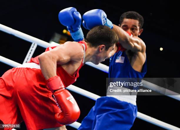 Kairat Yeraliyev of Kazakhstan fighting Duke Ragan of the USA in the bantamweight final bout of the AIBA World Boxing Championships in Hamburg,...
