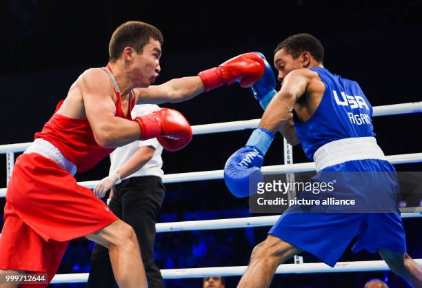 Kairat Yeraliyev of Kazakhstan fighting Duke Ragan of the USA in the bantamweight final bout of the AIBA World Boxing Championships in Hamburg,...