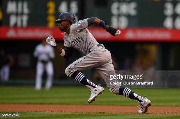 Dee Gordon of the Seattle Mariners runs the bases on a hit and run play and he would advance to third base in the first inning of a game against the...