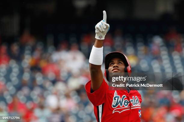 Seuly Matias of the Kansas City Royals and the World Team celebrates after scoring a run on a solo home run against the U.S. Team in the second...