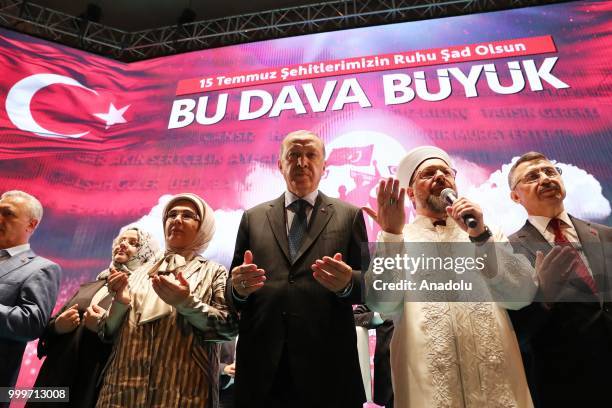 Turkish President Recep Tayyip Erdogan , his wife Emine Erdogan , President of Religious Affairs of Turkey Ali Erbas pray as they attend July 15...