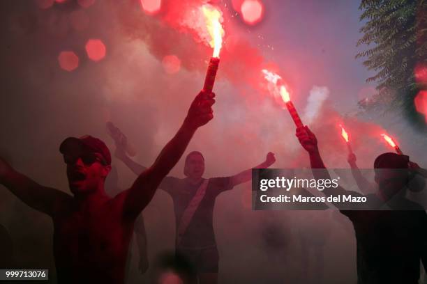 Rayo Vallecano fans shooting with flares during the annual water fight known as "Batalla Naval" in Vallecas neighborhood, where thousands of people...