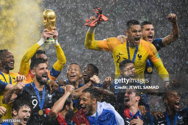 France's players lift the World Cup trophy after winning the Russia 2018 World Cup final football match between France and Croatia at the Luzhniki...