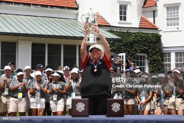 Laura Davies of England celebrates with the U.S. Senior Women's Open trophy after winning in the final round at Chicago Golf Club on July 15, 2018 in...