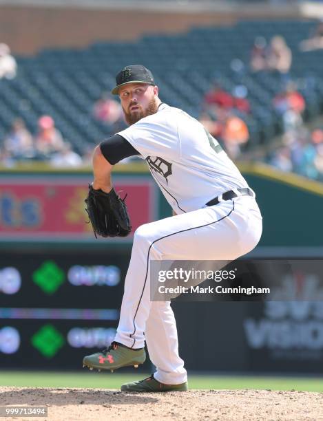 Buck Farmer of the Detroit Tigers pitches while wearing a special jersey, shoes and hat to honor Memorial Day during the game against the Los Angeles...