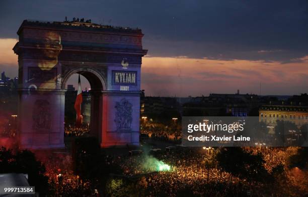 Kylian Mbappe is projected on the Arc de Triomphe des champs elysee as fans celebrate France’s victory over Croatia in the 2018 FIFA World Cup final...