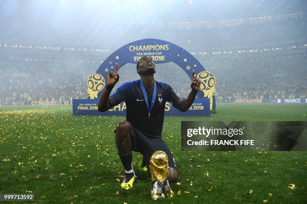 France's midfielder Paul Pogba celebrates with the World Cup trophy after the Russia 2018 World Cup final football match between France and Croatia...