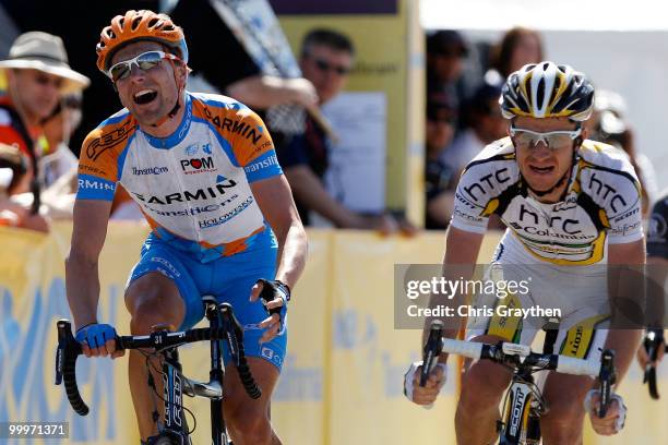 David Zabriskie of Team Garmin-Transitions celebrates as he crosses the finish line to win the third stage ahead of Michael Rogers of Australia...