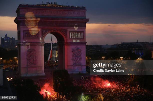 Florian Thauvin is projected on the Arc de Triomphe des champs elysee as fans celebrate France’s victory over Croatia in the 2018 FIFA World Cup...