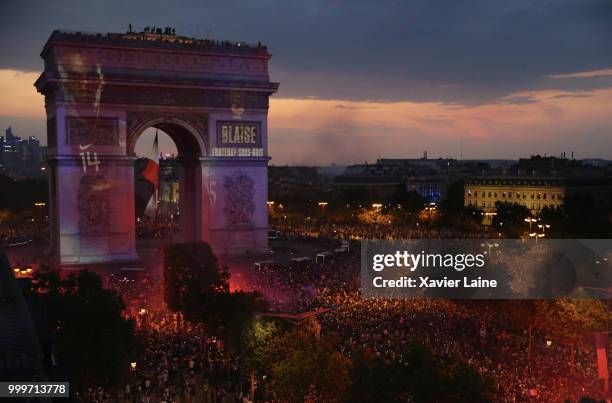 Blaise Matuidi is projected on the Arc de Triomphe des champs elysee as fans celebrate France’s victory over Croatia in the 2018 FIFA World Cup final...