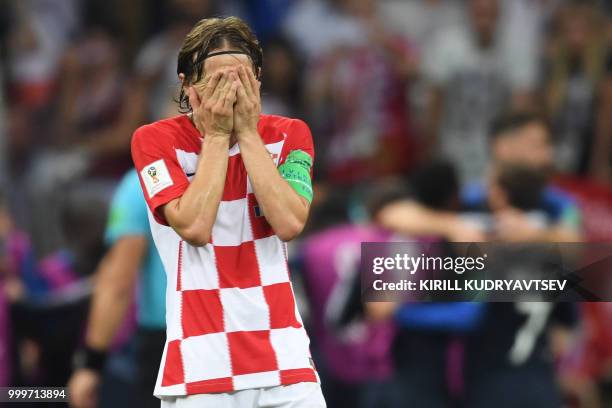Croatia's midfielder Luka Modric reacts after his team conceded a goal during the Russia 2018 World Cup final football match between France and...