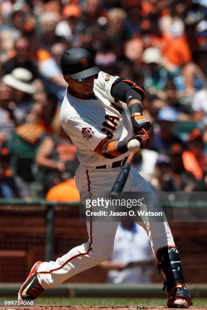 Gorkys Hernandez of the San Francisco Giants hits an RBI single against the Oakland Athletics during the second inning at AT&T Park on July 15, 2018...