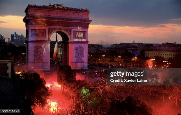 Paul Pogba is projected on the Arc de Triomphe des champs elysee as fans celebrate France’s victory over Croatia in the 2018 FIFA World Cup final at...