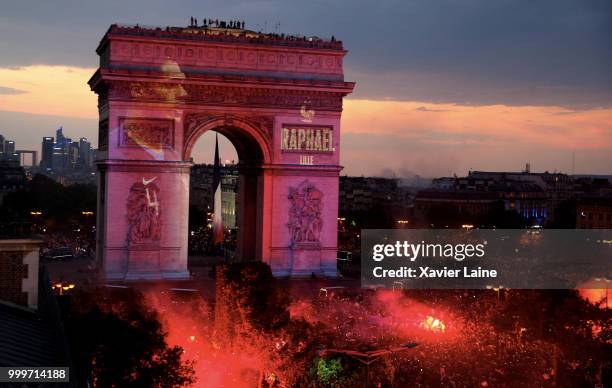 Raphael Varane is projected on the Arc de Triomphe des champs elysee as fans celebrate France’s victory over Croatia in the 2018 FIFA World Cup final...