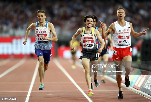Marcin Lewandowski of Poland crosses the line to win the Men's 1500m ahead of Timo Benitz of Germany and Neil Gourley of Great Britain during day two...