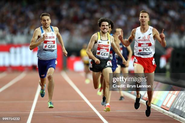 Marcin Lewandowski of Poland crosses the line to win the Men's 1500m ahead of Timo Benitz of Germany and Neil Gourley of Great Britain during day two...