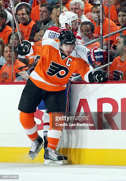 Mike Richards of the Philadelphia Flyers pins Josh Gorges of the Montreal Canadiens along the boards in Game Two of the Eastern Conference Finals...