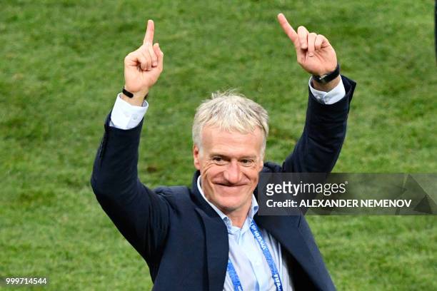 France's coach Didier Deschamps celebrates after winning at the end of the Russia 2018 World Cup final football match between France and Croatia at...