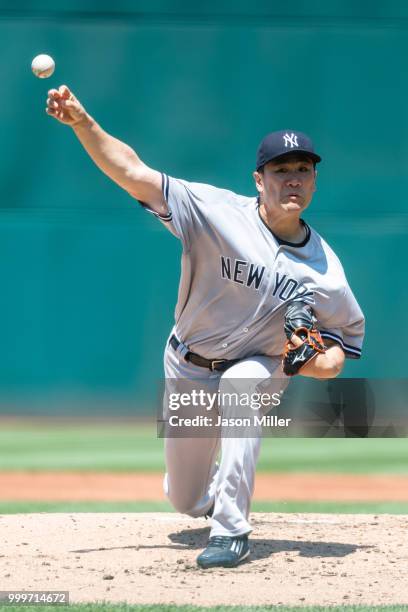 Starting pitcher Masahiro Tanaka of the New York Yankees pitches during the second inning against the Cleveland Indians at Progressive Field on July...