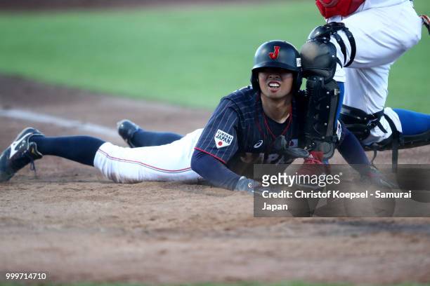 Toshiya Sato of Japan ist tagged out on home plate during the Haarlem Baseball Week game between Cuba and Japan at Pim Mulier Stadion on July 15,...