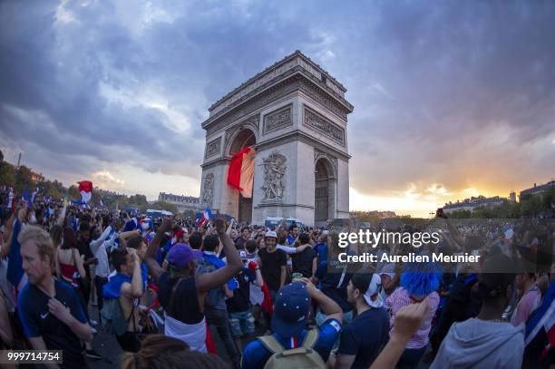 French fans gather at the Arc de Triomphe to celebrate France's victory over Croatia 4-2 in the 2018 FIFA World Cup final on July 15, 2018 in Paris,...