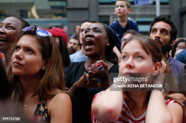 French fans react as they watch the World Cup final match between France vs Croatia on July 15, 2018 in New York. - The World Cup final between...