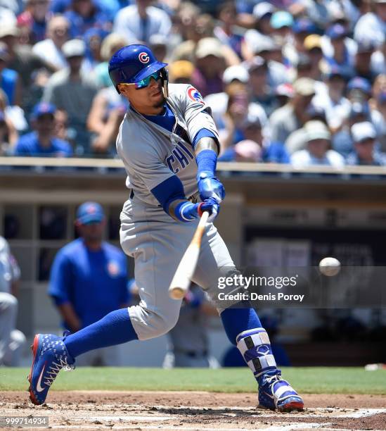 Javier Baez of the Chicago Cubs hits an RBI single during the first inning of a baseball game against the San Diego Padres at PETCO Park on July 15,...