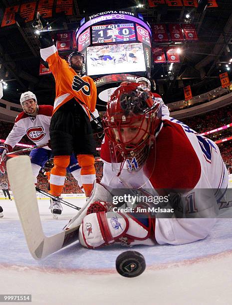 Jaroslav Halak of the Montreal Canadiens gives up a goal to Simon Gagne of the Philadelphia Flyers in the second period as Ville Leino celebrates in...