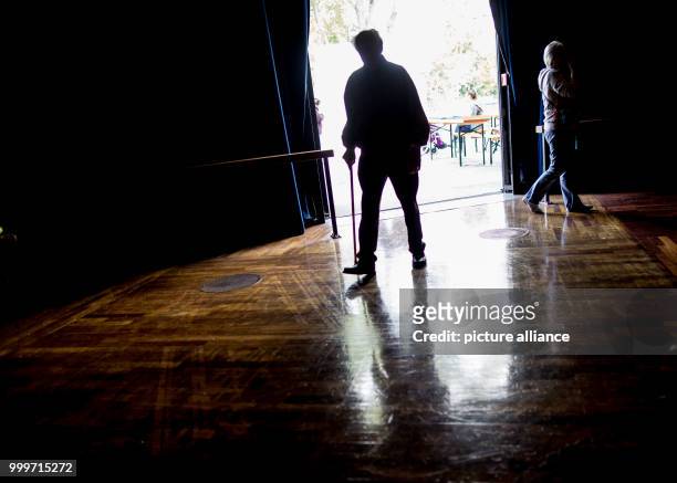 An elderly person can be seen at the assembly centre at the Jahrhunderthalle, where numerous residents of nursing homes will spend the day in...