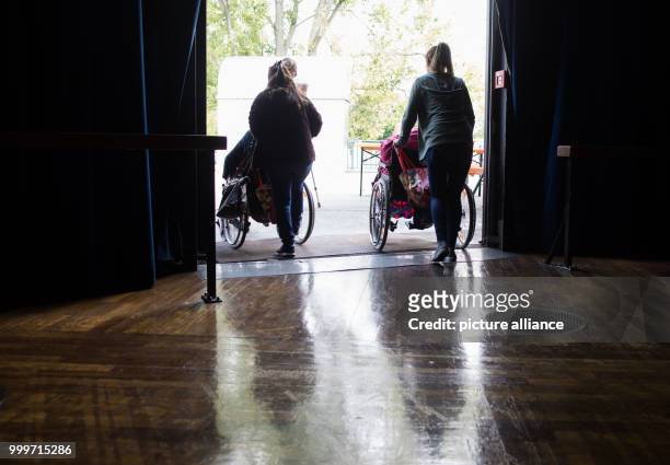 Group of elderly people can be seen at the assembly centre at the Jahrhunderthalle, where numerous residents of nursing homes will spend the day in...