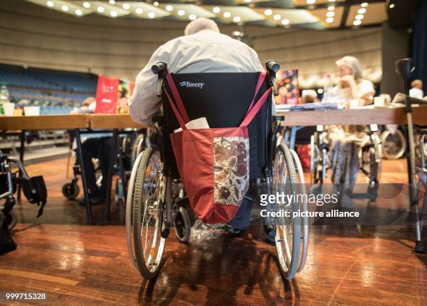 An elderly person can be seen at the assembly centre at the Jahrhunderthalle, where numerous residents of nursing homes will spend the day in...