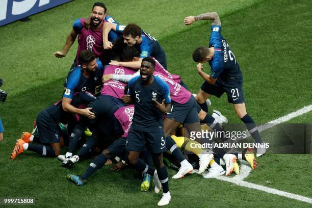 France's midfielder Paul Pogba celebrates with teammates after scoring a goal during the Russia 2018 World Cup final football match between France...