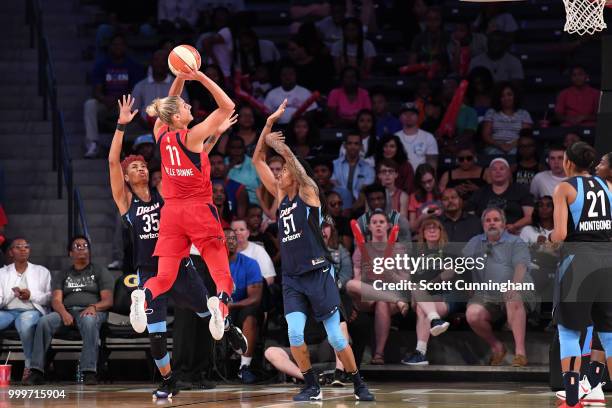 Elena Delle Donne of the Washington Mystics shoots the ball against Jessica Breland of the Atlanta Dream and Angel McCoughtry of the Atlanta Dream on...