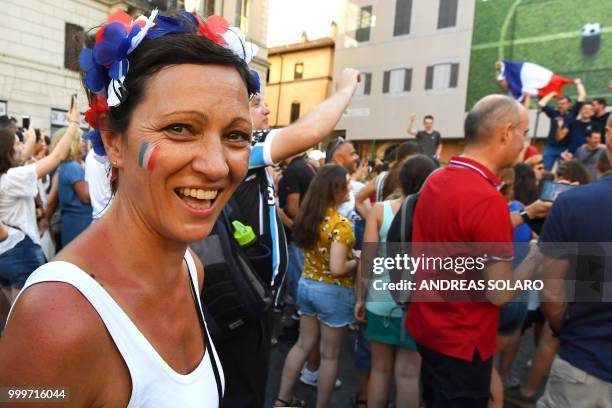 French supporters celebrate at the end of the Russia 2018 World Cup final football match between France and Croatia, on July 15, 2018 in the Campo di...