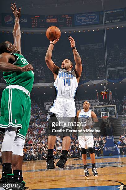Jameer Nelson of the Orlando Magic shoots against Kendrick Perkins of the Boston Celtics in Game Two of the Eastern Conference Finals during the 2010...
