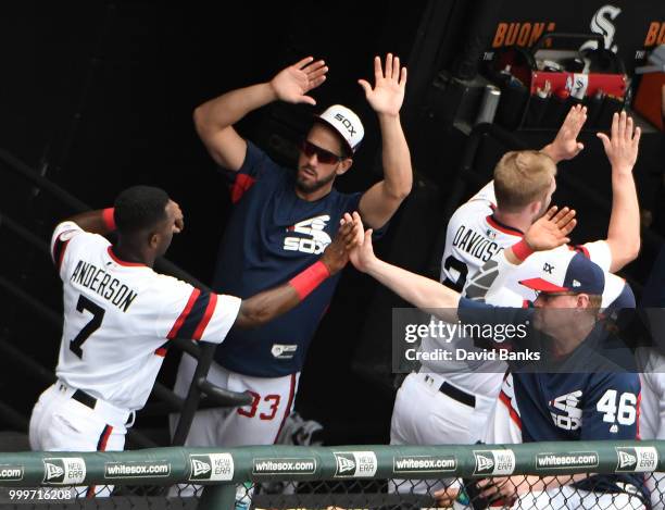 Tim Anderson of the Chicago White Sox is greeted by James Shields of the Chicago White Sox after scoring against the Kansas City Royals during the...