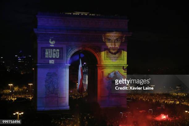 Hugo LLoris is projected on the Arc de Triomphe des champs elysee as fans celebrate France’s victory over Croatia in the 2018 FIFA World Cup final at...