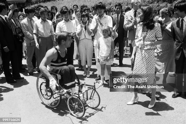 Crown Prince Akihito, Crown Princess Michiko, Prince Naruhito, Prince Akihito and Princess Sayako encourage Canadian wheelchair athlete Rick Hansen...