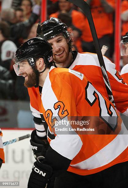 Ville Leino and Braydon Coburn of the Philadelphia Flyers celebrate after Leino's goal against the Montreal Canadiens to give the Flyers a 3-0 lead...