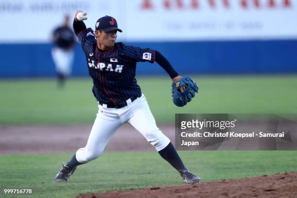 Noboru Shimizu of Japan throws the ball to the first base too end the fifth inning during the Haarlem Baseball Week game between Cuba and Japan at...