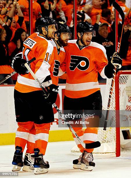 Ville Leino of the Philadelphia Flyers celebrates with teammates Blair Betts and Andreas Nodl after scoring a goal in the third period against the...