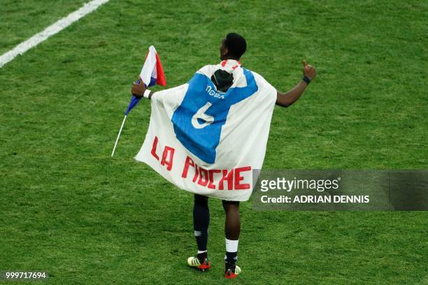 France's midfielder Paul Pogba celebrates after winning at the end of the Russia 2018 World Cup final football match between France and Croatia at...